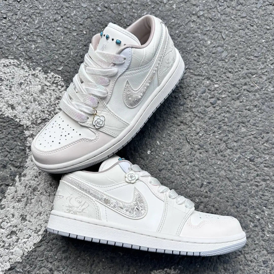 White camellia-themed custom sneakers with beaded details